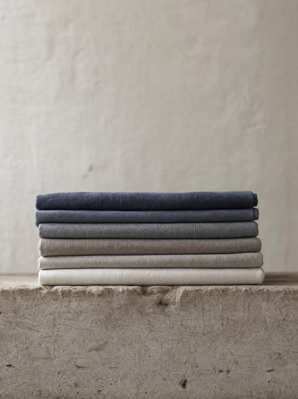 A neatly folded stack of garments photographed at eye level